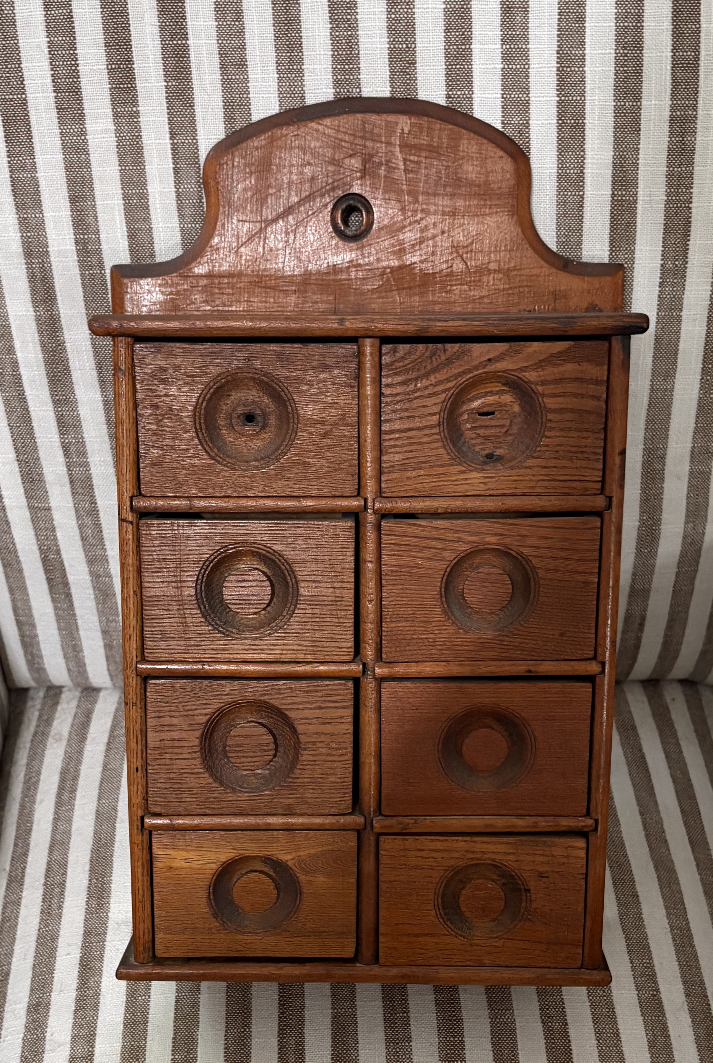 The small wooden cabinet with drawers that hung in Agnes's kitchen